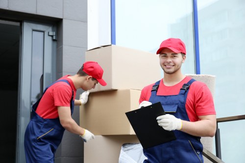 Man and van team handling boxes and appliances in Manorhouse