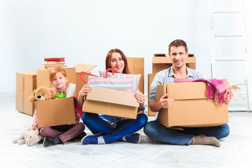 Moving van and packed boxes for house removals in Manorhouse