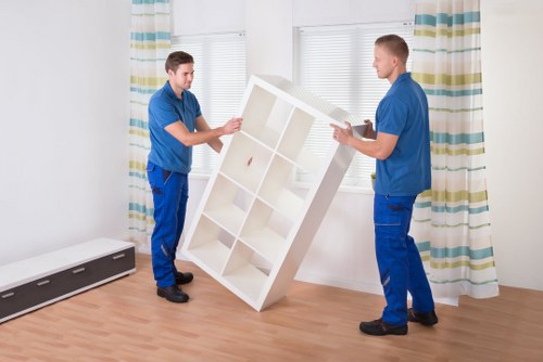 Professional movers handling furniture during a Manorhouse relocation